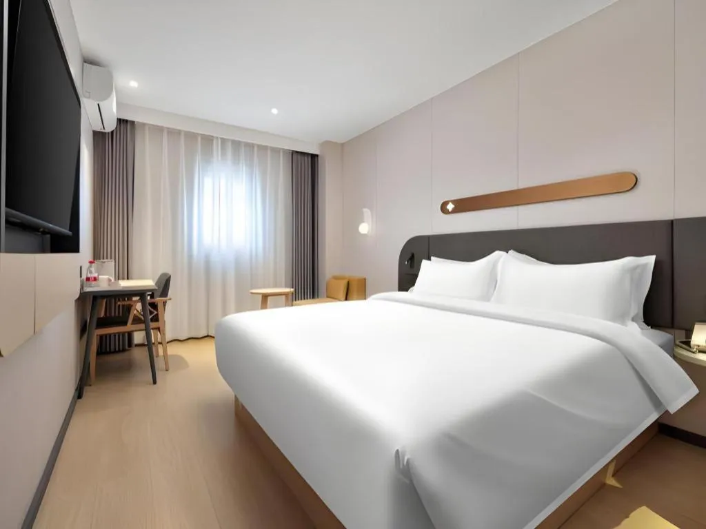 Bed in Jinjiang Inn Beijing Capital International Airport New Expo Metro Station