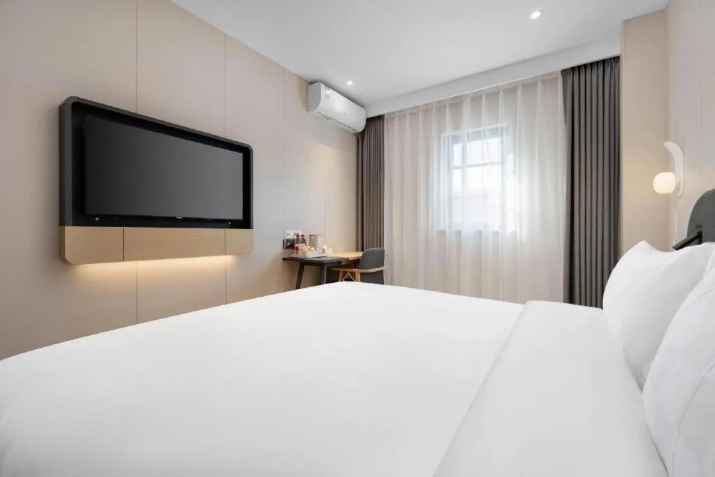 Bed in Jinjiang Inn Beijing Capital International Airport New Expo Metro Station