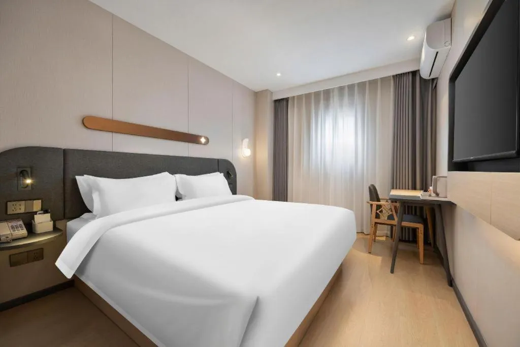 Bed in Jinjiang Inn Beijing Capital International Airport New Expo Metro Station