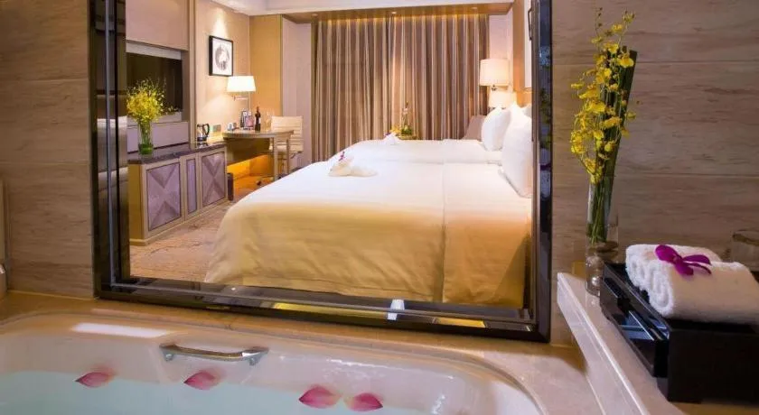 Bed in New Century Grand Hotel Hangzhou Zheshang