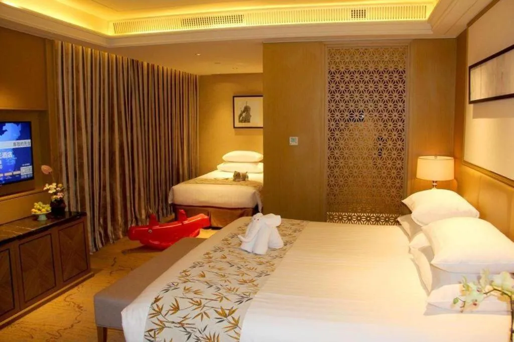 Bed in New Century Grand Hotel Hangzhou Zheshang