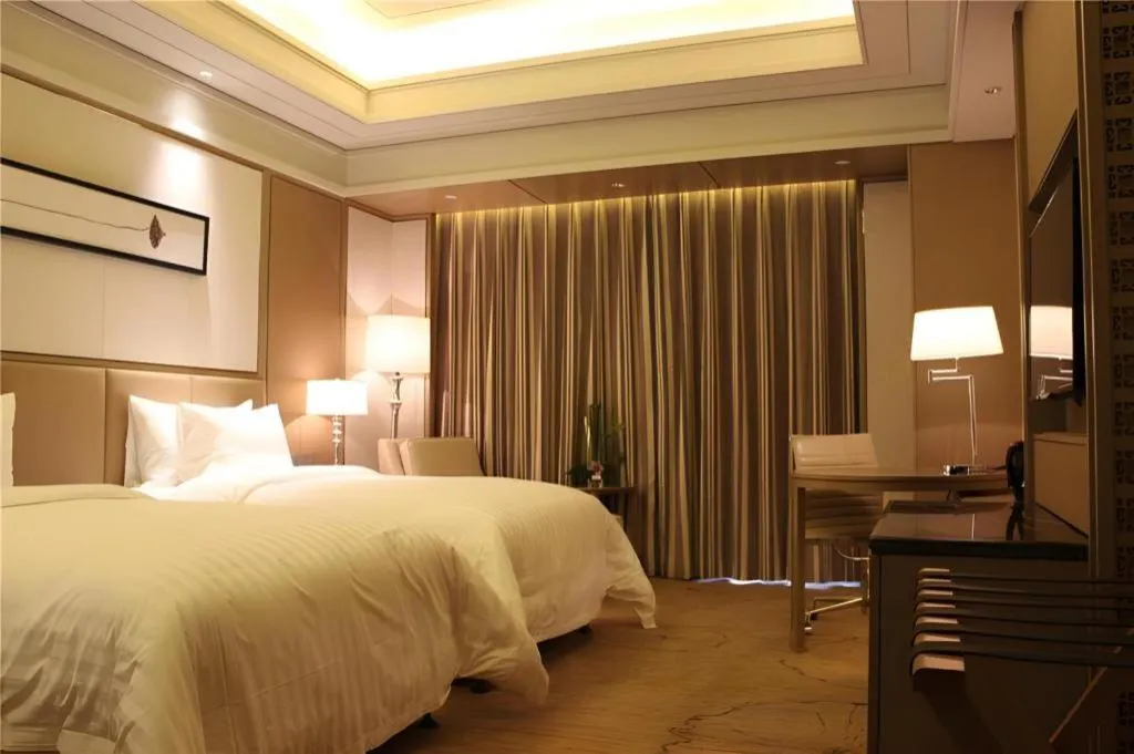 Bed in New Century Grand Hotel Hangzhou Zheshang