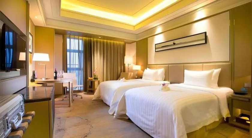 Bed in New Century Grand Hotel Hangzhou Zheshang