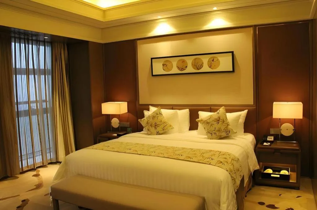 Bed in New Century Grand Hotel Hangzhou Zheshang
