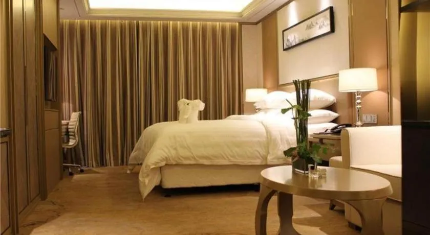 Bed in New Century Grand Hotel Hangzhou Zheshang