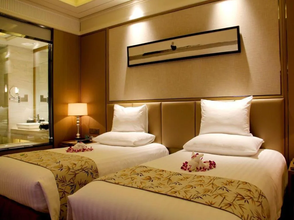 Bed in New Century Grand Hotel Hangzhou Zheshang