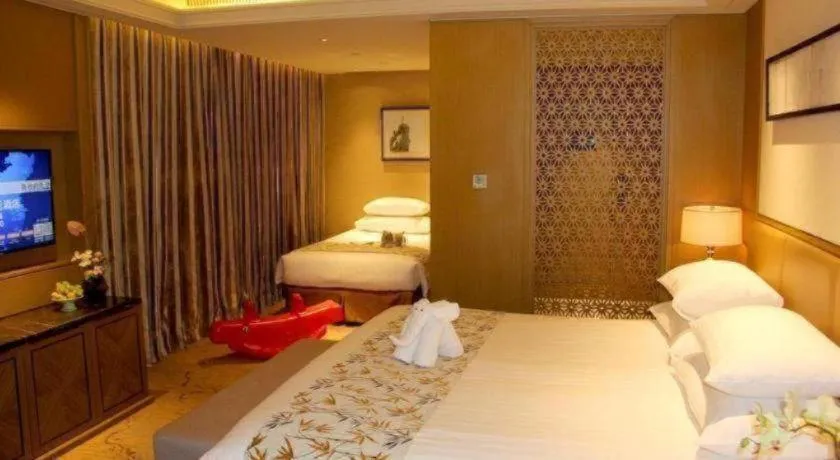 Bed in New Century Grand Hotel Hangzhou Zheshang