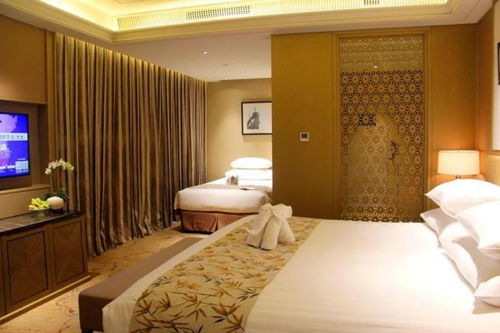 Bed in New Century Grand Hotel Hangzhou Zheshang