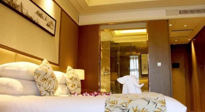 Bed in New Century Grand Hotel Hangzhou Zheshang