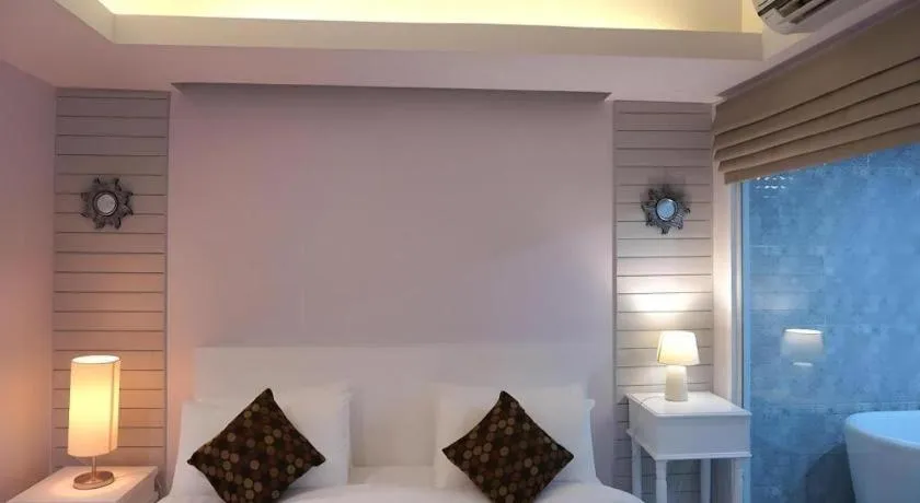 Bed in NanNakara Boutique Hotel