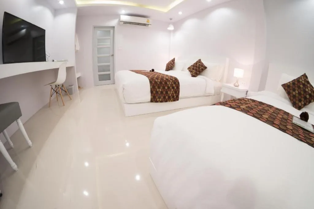 Bed in NanNakara Boutique Hotel