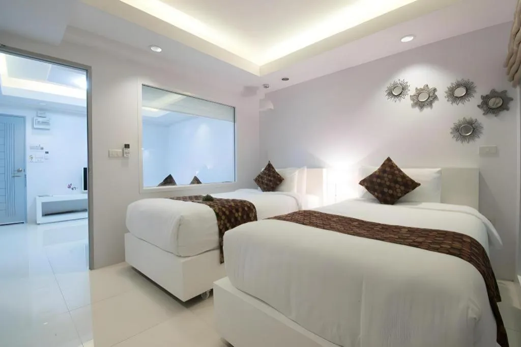 Bed in NanNakara Boutique Hotel
