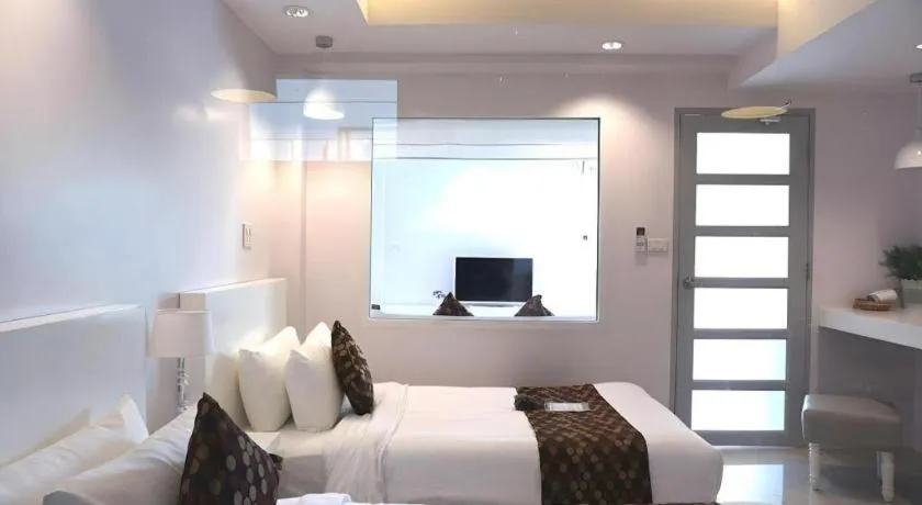 Bed in NanNakara Boutique Hotel