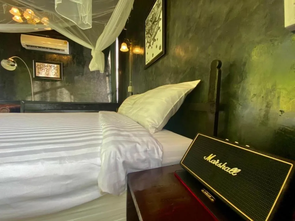 Bed in The White House Boutique Resort