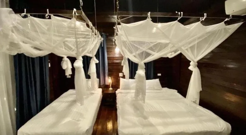 Bed in The White House Boutique Resort