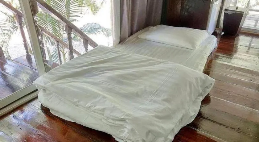 Bed in The White House Boutique Resort