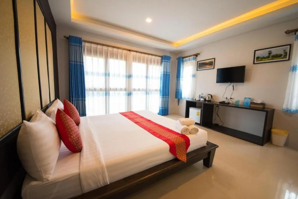 Bed in Poochommhok Resort