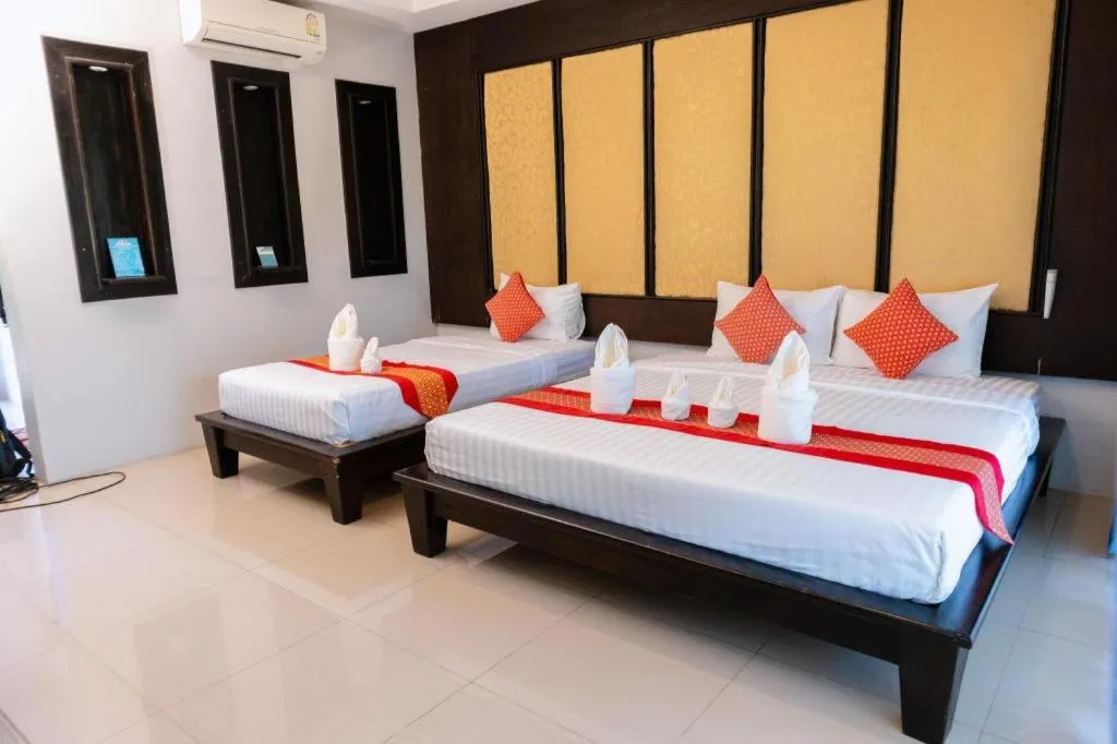 Bed in Poochommhok Resort