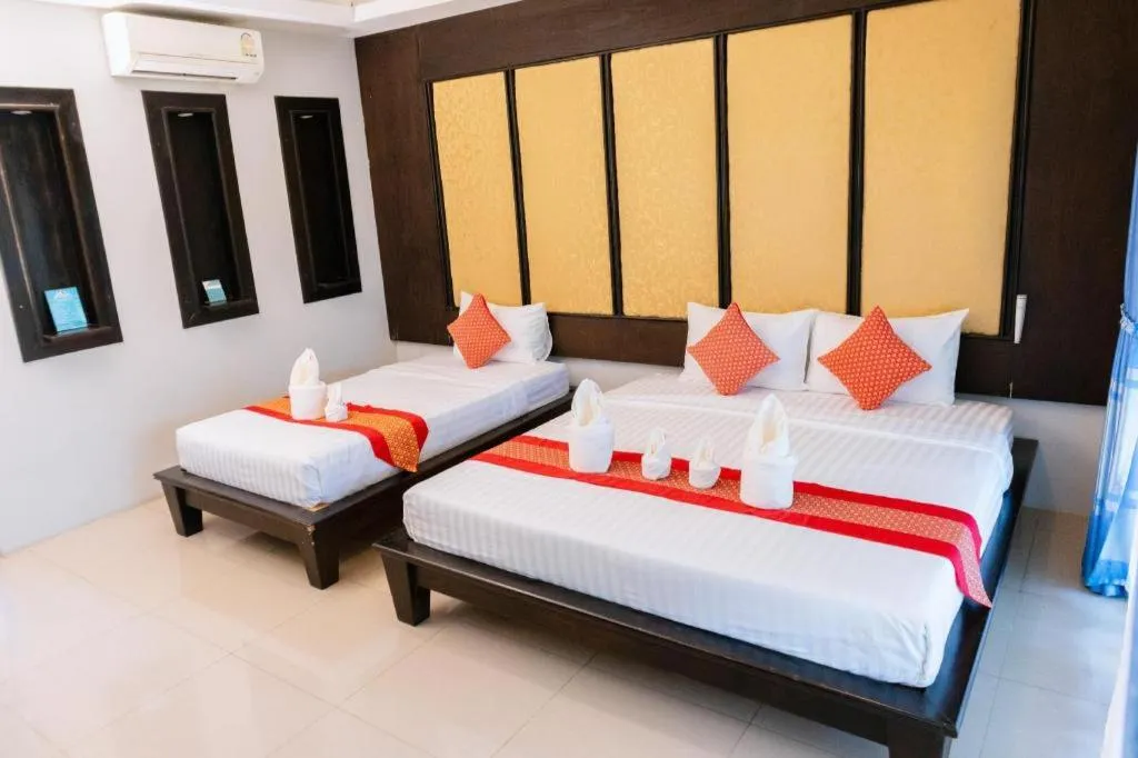 Bed in Poochommhok Resort