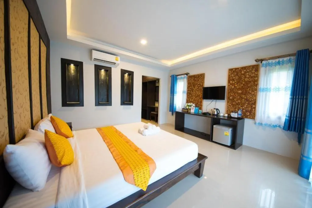 Bed in Poochommhok Resort