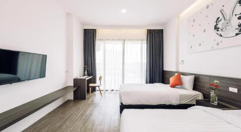 Bed in PIMDARA HOTEL