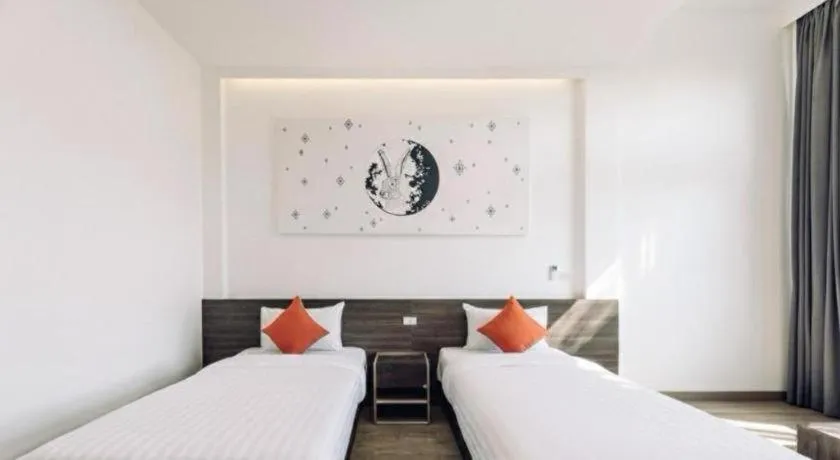 Bed in PIMDARA HOTEL