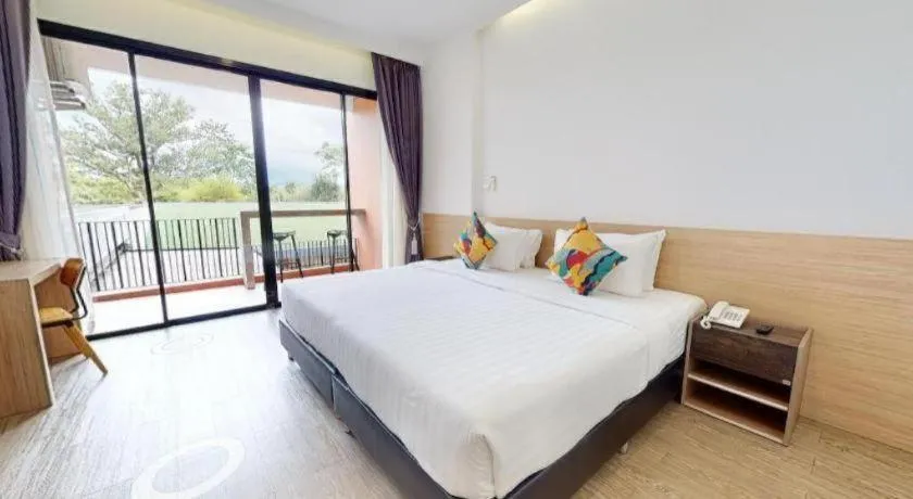 Bed in PIMDARA HOTEL