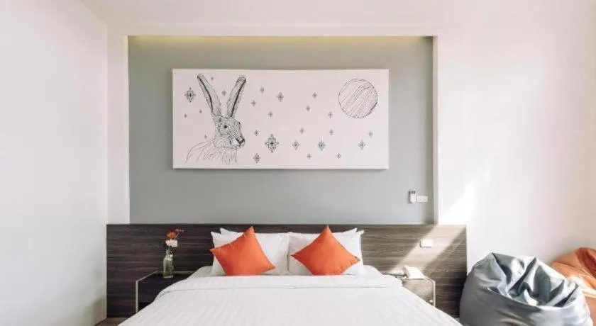 Bed in PIMDARA HOTEL