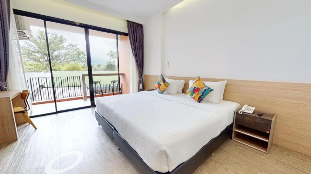 Bed in PIMDARA HOTEL