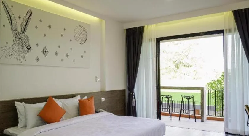 Bed in PIMDARA HOTEL