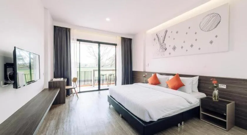 Bed in PIMDARA HOTEL