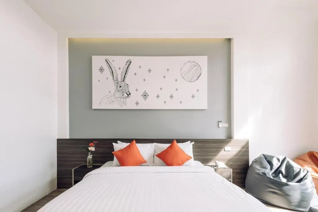 Bed in PIMDARA HOTEL