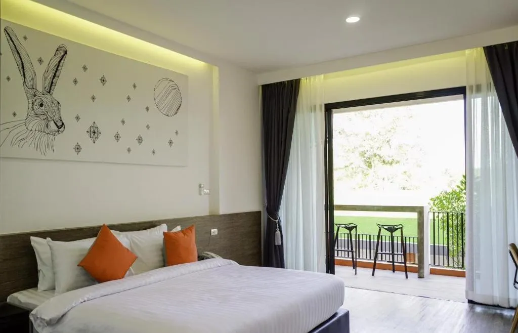 Bed in PIMDARA HOTEL