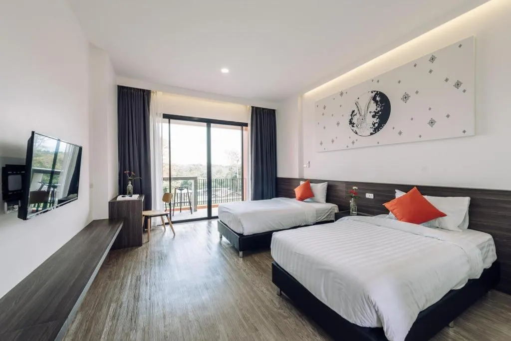 Bed in PIMDARA HOTEL