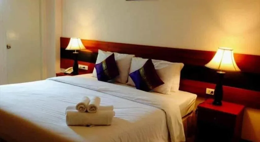 Bed in Sirimathani Hotel