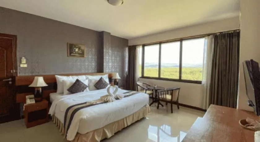 Bed in Sirimathani Hotel