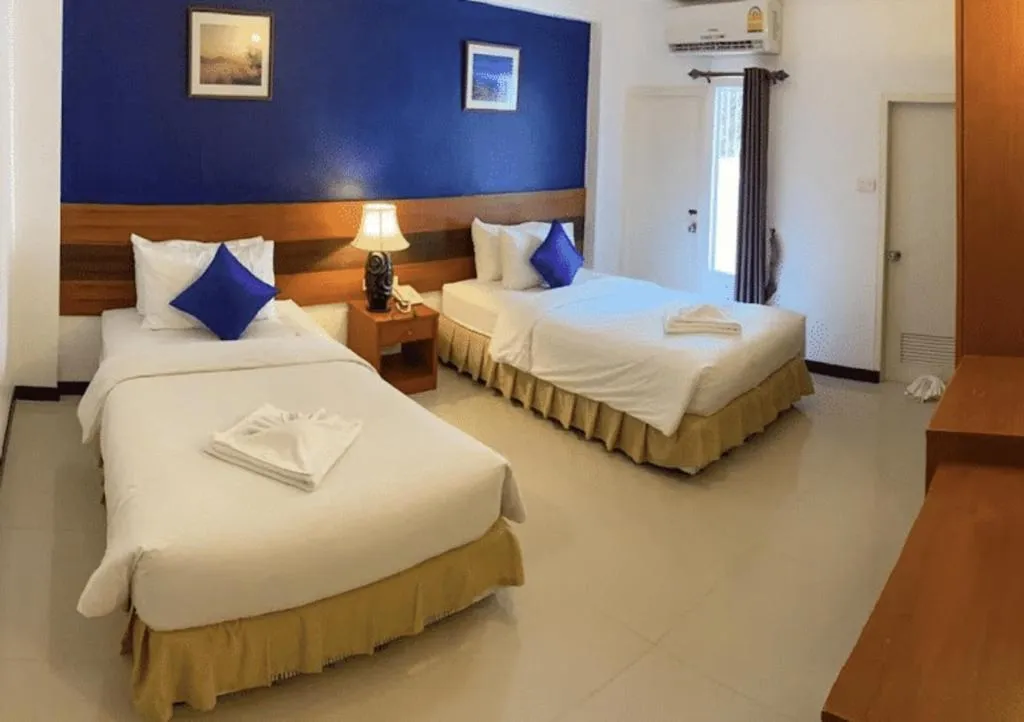 Bed in Sirimathani Hotel