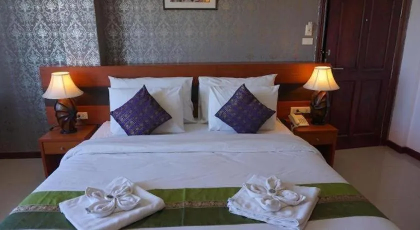 Bed in Sirimathani Hotel