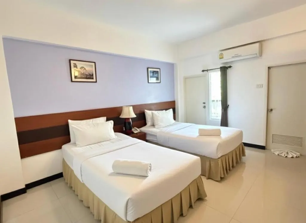 Bed in Sirimathani Hotel