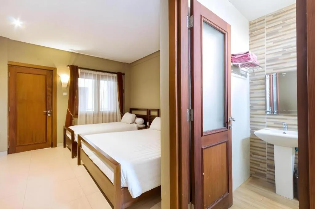 Bed in Hotel Adilla Syariah Ambarukmo