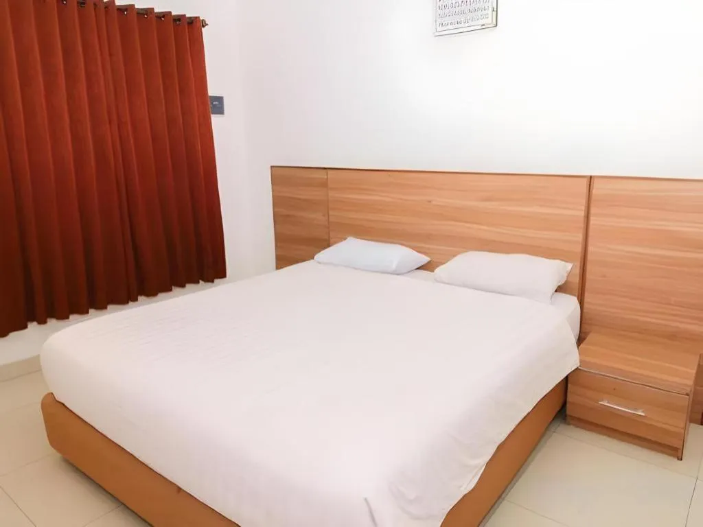 Bed in Hotel Adilla Syariah Ambarukmo