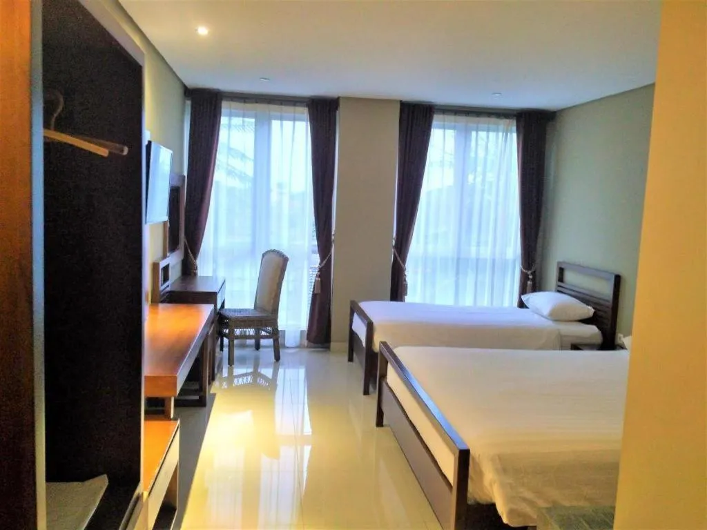 Bed in Hotel Adilla Syariah Ambarukmo