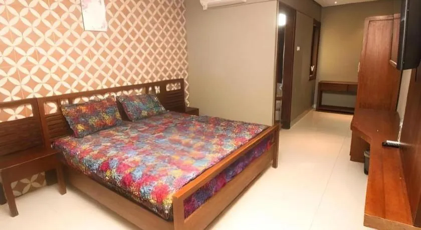 Bed in Hotel Adilla Syariah Ambarukmo