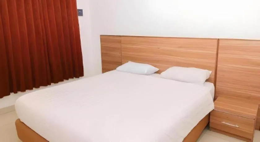 Bed in Hotel Adilla Syariah Ambarukmo