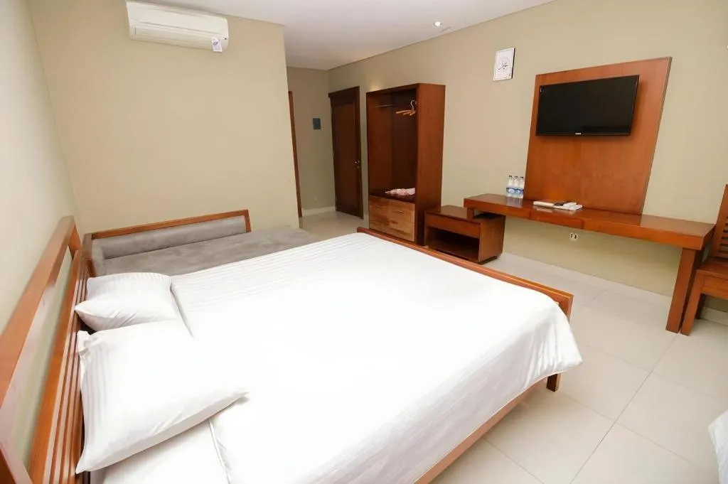 Bed in Hotel Adilla Syariah Ambarukmo