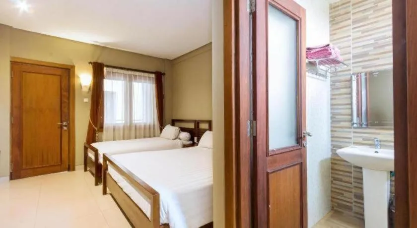 Bed in Hotel Adilla Syariah Ambarukmo