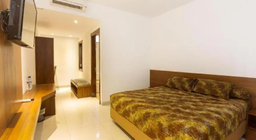 Bed in Hotel Adilla Syariah Ambarukmo