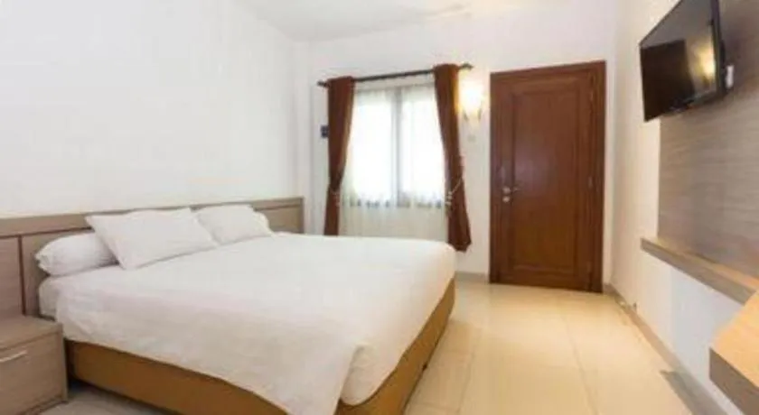 Bed in Hotel Adilla Syariah Ambarukmo