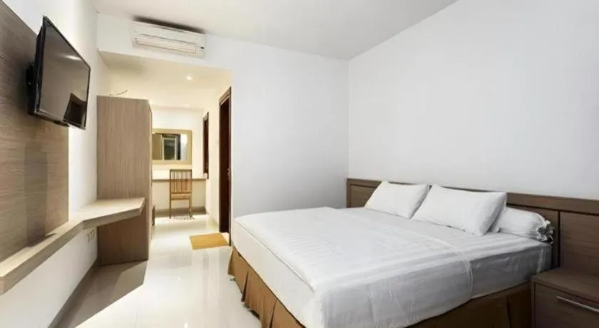 Bed in Hotel Adilla Syariah Ambarukmo