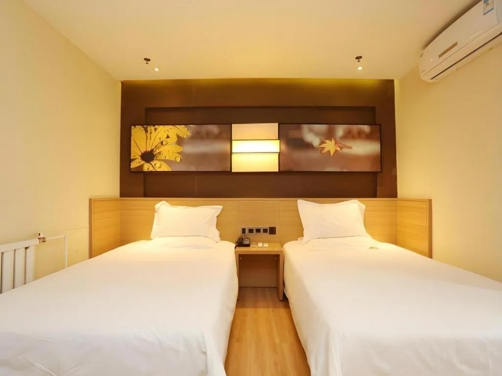 Bed in IU Hotel Tianjin Xiqing Zhong Bei Zhen Branch